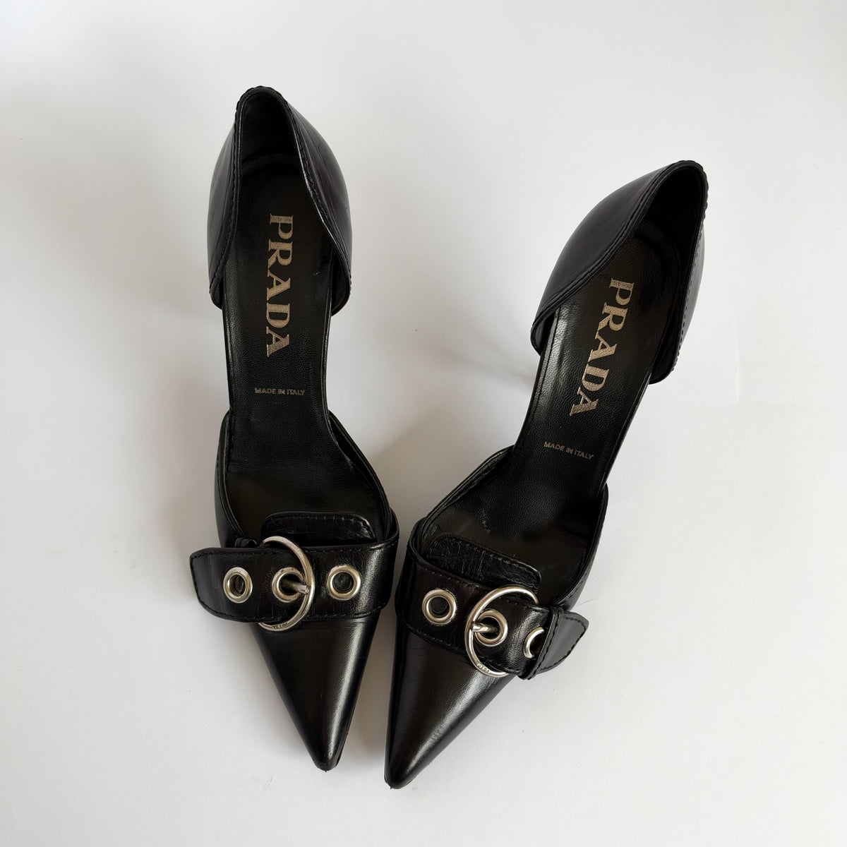 Prada Eyelet Buckle Heels Black (36.5 EU)