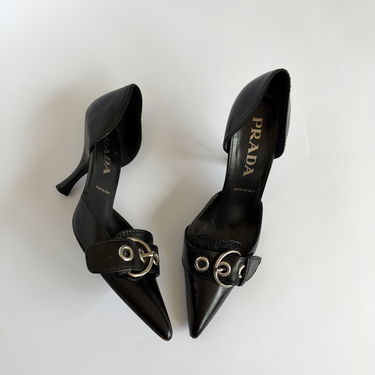 Prada Eyelet Buckle Heels Black (36.5 EU)